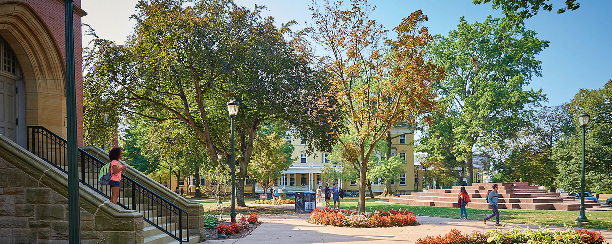 Students walking on Mather Quad in the fall